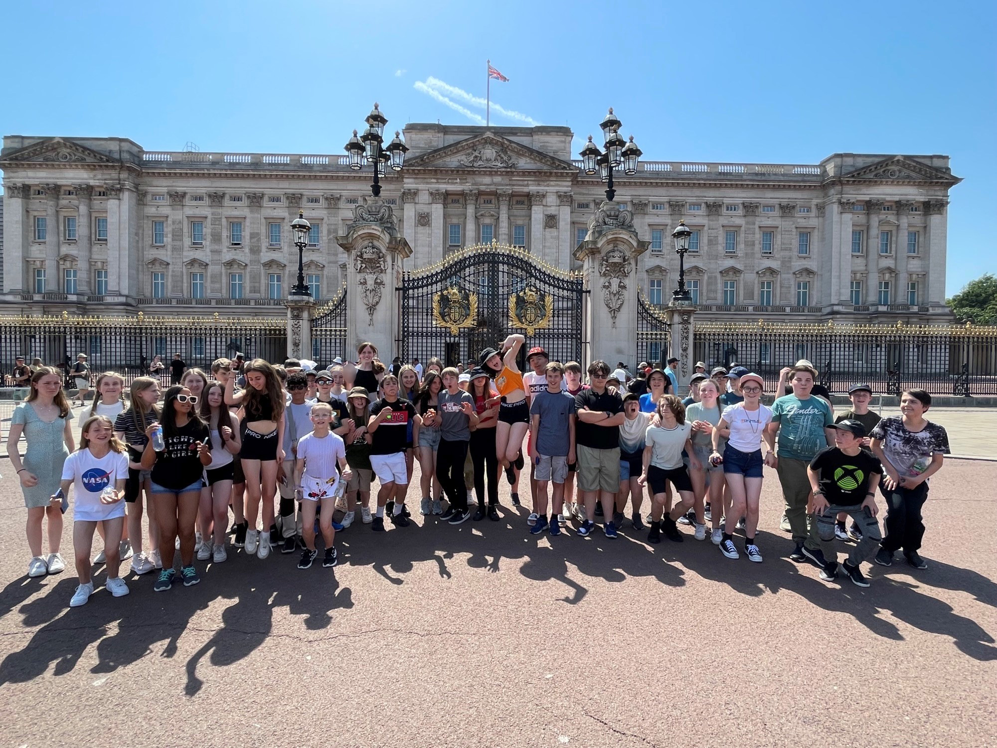 Teacher with group of students on educational tour